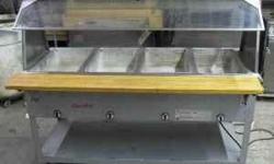 Used Duke 4-well hot food buffet with sneeze guard and shelf.