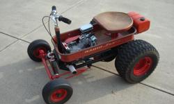 Hot Rod Radio Flyer wagon.&nbsp; 6 1/2 HP Honda clone engine with spring front suspension and full differential rear end which makes for easy handling.&nbsp; Top speed is approximately 25 MPH.&nbsp; Wagon was built about 8 years ago and has been to a