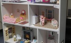 This listing is for a beautiful 7 room custom made and furnished dollhouse for Barbie.&nbsp; It is furnished with great love and detail....from the oriental rugs, diapers, wipes, toys in the nursery to the Scott tissue, Crest toothpaste, Ivory Soap,