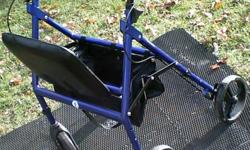 This is a heavy - duty resting seat walker / rolloator with large 8" wheels and wider seat . Made by Hugo , welded aluminum frame , multiple pockets , hand brakes , 300 pound capacity . Unit is higher quality than ones you can buy for $80 - $120 new
