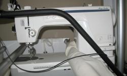Mega Quilter has extra large machine throat (9" X 6"), 1600 stitches per minute, electronic speed control, simultaneous bobbin winding, thread pre tension, automatic thread cutter (upper and lower), stand alone extension table. Excellent condition.