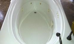 Jacuzzi brand whirlpool bath,excellent condition, 72"x42" white, comes completely plumbed, with motor and Delta hardware