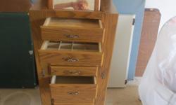 eight drawer free standing. very good condition. Sides open up for hanging articles. Ring slots, Bigger drawers for
purses etc.