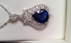 One of a kind Sapphire white diamond pendent , the Sapphire is huge 9 carats plus pear shape and the Diamonds are VS to SI G to H in color and 1.48 carats with 14 K white gold , even the chain is white gold 14 K ! Must sell and serious callets only !!!