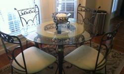 Kitchen / Dining Room Table For Sale
Painted wrought iron round glass table with four (4) chairs is for sale.
The table has a beveled round glass that measure 44 inches in diameter.
The table includes four (4) wrought iron chairs that have an off-white (