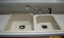 Kohler cast iron porceline double kitchen drop-in almond sink with Delta single control kitchen sink faucet & sprayer excellent shape. &nbsp;33" L X 22" W X7 1/2" Deep. &nbsp;Call Jan -- &nbsp;Cash only.
