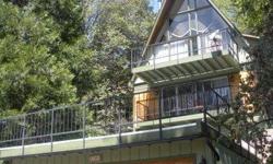 THIS BEAUTIFUL MOUNTAIN HOME IS LOCATED IN THE SAN BERNARDINO MOUNTAINS IN THE RESORT TOWN OF LAKE ARROWHEAD. THE PROPERTY HAS 'LAKE RIGHTS' TO THE PRIVATE LAKE ARROWHEAD FOR YOUR ENJOYMENT OF BOATING, WATER SKIING, HIKING, BEACH ACCESS ETC. THE HOME IS