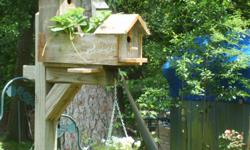 Large handmade cedar birdhouses and feeders just in time for nesting season.These houses and feeders mount on a 4x4 pole so they a very stable .I will suppy the pole for 10.00 if you need one.I also make garden furniture,wishing wells and childrens