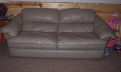 2 tan leather couches.
7 feet long
3 1/2 feet deep
2 feet 9 inches high (back)
see photo