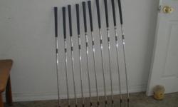 Complete set of LEFT HANDED Wilson Staff - Mid Size - Irons. 2 thru SW. Pure Spin 60 degree lob. All Excellent Condition. Taylor Made 1, 3, and 5 Burner Bubbles, good condition, w/covers.