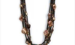 Tribal style is hot, so that's what we've got! Get designer dazzle with this chunky multi-strand necklace, dotted with leopard conch shell beads and tasteful black and bronze accents. Shell beads; leatherette accents. 17 1/2" long (adjustable to 19").