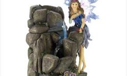 #12540 Lighted Fairy Fountain
A lavender fairy pauses beside an enchanted waterfall, delighting in the water's sooting song. Lighted fountain adds story book fascination to your home, office or garden!
Weight 4.2 lbs. Polyresin. Pump included. UL