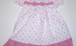 Sweet pink cotton print dress has puffy capsleeves, bow accents the front, button closure in back, tie back ribbon, and attached crinoline slip for fullness. Dress is 100% cotton with a 100% polyester lining. Another quality "Lito" product made in the