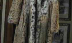 One of a kind, exceptional coat available now in time for holiday special. Size 6. Luxurious feel. Custom designed
and made for petite female. You'll want to see this full length coat. A VERY SPECIAL gift for the deserving woman
in your life (or for