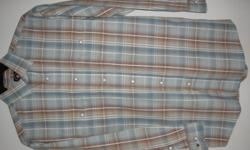 Beautiful plaid with snaps on pockets, cuffs and front. Never worn. Size small