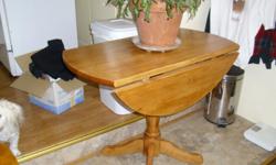 3 foot circlular drop leaf table excellent for small dinning area's. maple finish