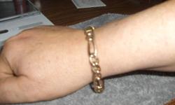 Men's 8.75 inch 10K Gold Figaro Bracelet. Mint condition.
Weighs 22 grams.
Offered by Jungle Boys Private Stock, Holden, ME
