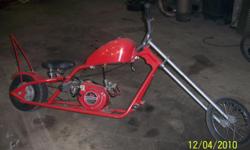 red in color, 5 horse power honda ohv, runs great