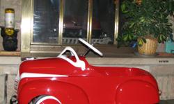 Early Murray Peddle Car fully restored with Amron paint. This car has a never before seen Chrysler emblem on the rear and has a white leather seat. The professional paint work is a thing of beauty and would make a great prop for a photographer or for a