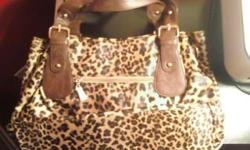 MEDIUM-SIZED BROWN LEOPARD CMG PURSE FOR SALE!!!
I bought this purse in the Philippines for 2, 499.00 Philippine Pesos (this equivalents to about $57.00 U.S. Dollars)
In the Philippines, CMG purses are like our Coach purses (very expensive and fabulous