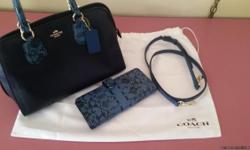 Brand new navy blue with snakeskin accent and matching wallet. New both were $490. Asking $350