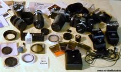 Nikon FG-20 and Nikon N-2000 cameras plus lenses, caps, filters, flashes, rewind motor, case, instruction manuals, cleaning supplies etc. Great kit for someone who likes film photography. Sell all. It is all in near MINT condition and well maintained. You