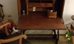 Early American desk with&nbsp; chair. The desk measures 36"L x 17"W x 45"H with drop down leaf of 14" Call -- or e-mail me.&nbsp;