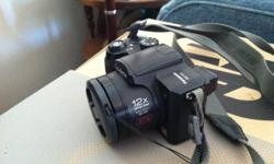 Panasonic DMC FZ5 - used quite a lot, upgraded to a new camera. Samsonite camera case too.