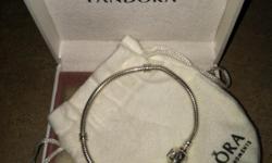 Pandora 7.1" sterling silver bracelet / originally $65.00
Daughter received 2 Pandora bracelets for her birthday