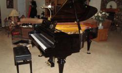 Beautiful grand piano at a great price. One owner, purchased new in 2004. Player (Pianomation) with CDs.
Touch weight adjusted. 6.5' long.