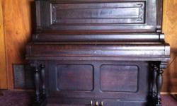 Harrington upright piano,early American, dark wood, very ornate.