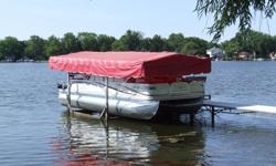 2003 Aqua-Matic Pontoon Lift, with electric motor, and newer canopy. Contact Jim at 262-628-4474.