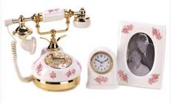 Instantly create an atmosphere of genteel sophistication? just add this matched set of porcelain floral accessories to your desktop or end table! Matching telephone, clock and photo frame create a lovely coordinated look. Telephone features: 70 message