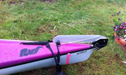 Pacific Water Sports kayak with two hatches, movable rudder, white and purple. Includes skirt, seat and life jacket. Very seaworthy and efficient. Small wheel set for short distance travel...fit in hatch. Original retail $2300.00