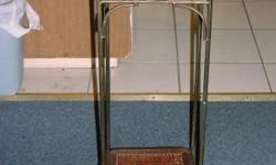 Nice rattan/wicker plant stand in great condition. Rattan is in good shape. Has nice decorative scroll on metal.