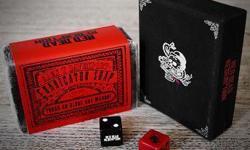 ALL BRAND NEW AND UNOPENED
Includes:
Red Dead Redemption Deluxe Playing Cards - original artwork playing cards in a deluxe clothbound case.
Red Dead Redemption Dice - Set of black and red dice, with Rockstar and Red Dead Redemption logos, storable in the