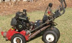 Toro 1000 greens mower - remote steering- One of a Kind- you can not imagine the response
your neighbors will have when they see it. It was to fast to walk behind - so I set up a remote steering system that allows you to drive the unit up to 100 yeads