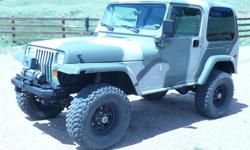 1991 Jeep Wrangler Rock Crawler. 4.0 Inline 6 cylinder, fuel injected engine. Automatic Transmission. Air conditioning, hard top and hard doors, plus additional soft top. Rubicon prototype, heavily modified. Air lockers, Warn winch, Dana 44 differentials