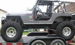 this is a 91' jeep wrangler 4x4. built from the ground up by tommyc's offroad. vehicle drives itself. to many features to list. please call for specifics. trailer has air brakes and is included. Mulitple doors and tops, included. have extra parts also