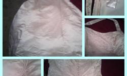 Romantic Gowns size 18 halter gown. It has beading all over the bust, halter strap, back, all the way down to the train & all over the train. The train is about 7ft long. It's only been worn once. The zipper works, their is button detail down the back to