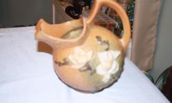 A beautiful Roseville ice pitcher a small chip on bottom rim does not show when displayed
