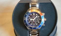Seiko Solar Powered Chronograph Divers Watch. Stainles steel case,&nbsp; blue face, blue and red besel. numerals and hands glow in dark, date, and is water proof to 200 meters. Band has a double locking clasp. Watch is only three months old, and has never