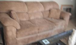 beige sofa excellent condition with wroght iron and glass sofa table and end tables a must see