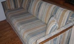 Light blue, beige, and white sleeper sofa. Good condition.