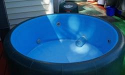 THIS IS A THREE PERSON HOT TUB WITH JETS AND A HEATER, 120VOLT PLUG 30 AMP. BREAKER