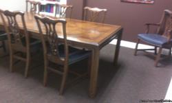 Beautiful dining room table and chairs build from solid pecan . This has been used as a conference room table in a lawyers office for the last 10 years. Lawyer is remodeling office. Table has 2 leaves and opens up to 10 feet so it will seat 10 people very