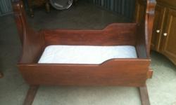 Here is a nice solid wood baby cradle. Call (423) 653-5990 and ask for Kim if you are interested.
