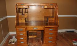 large solid wood entertainment center. 6 pieces. very nice from a non smoking home. $300.00&nbsp;&nbsp; large roll top desk. excellent condition.&nbsp; $300.00&nbsp; keller two leaf dining table with 6 castor chairs. good condition. $200.00&nbsp; located