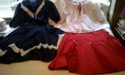 Two very lovely outfits; ladies size large; fits 14-16. One is blue denim; featuring white "V" formation fringe front and back. Button front top; very roomy. Skirt is 1/2 elastic waist with a pearl domed side placket.Very comfortable.
Red skirt features