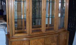 beautiful stanley burlwood china cabinet and dining table with 4 chairs and a leaf. the furniture is in great condition-about 5-6 years new.the china cabinet has mirrored back with beveled glass in the front.the glass shelves are thick and tempered. the